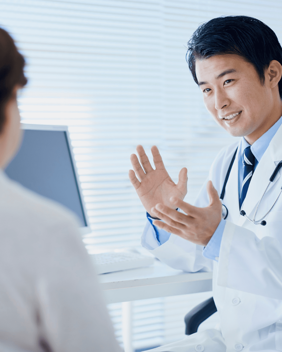 doctor talking to patient about the long term effects of a concussion after a car accident